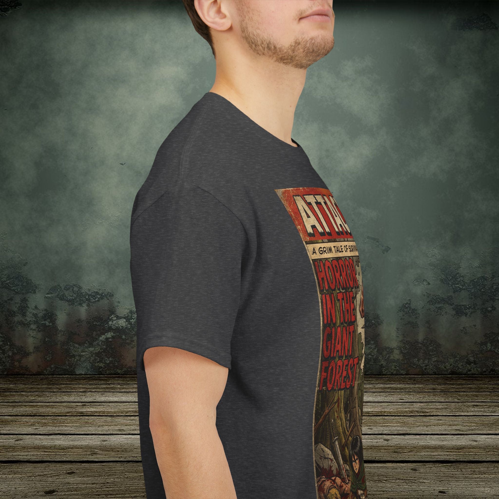 Person wearing a dark gray t-shirt with a graphic design on a textured wall background