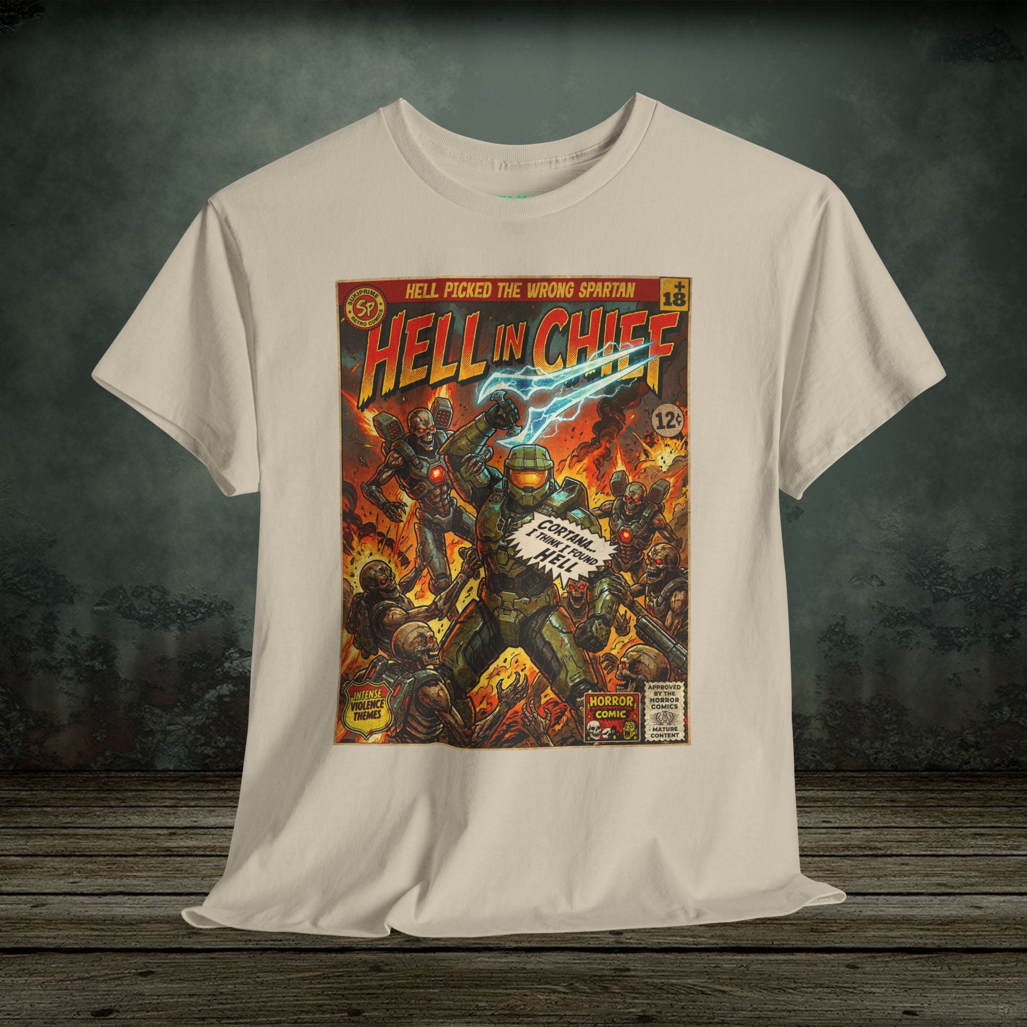 White t-shirt with 'Hell in Chief' comic book cover design on a wooden surface.