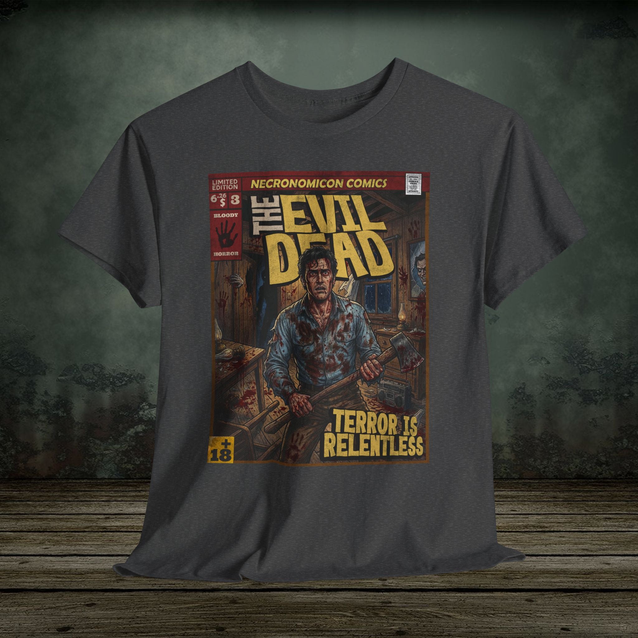 Gray t-shirt with 'The Evil Dead' comic book cover graphic on a wooden surface.
